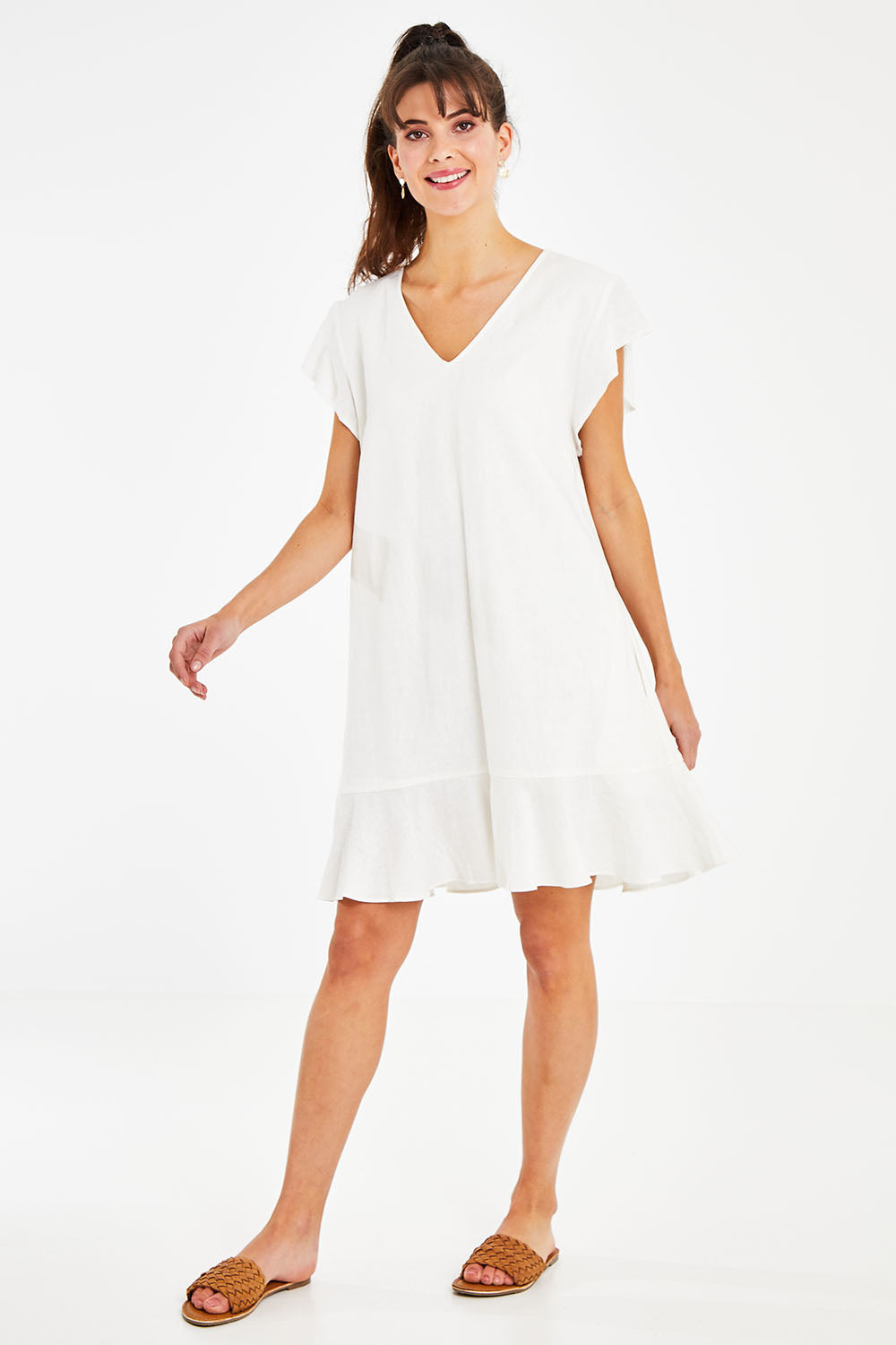 Model Courtney wearing size 10 of the Maree Dress in colour White (White), from the front, showing the whole outfit