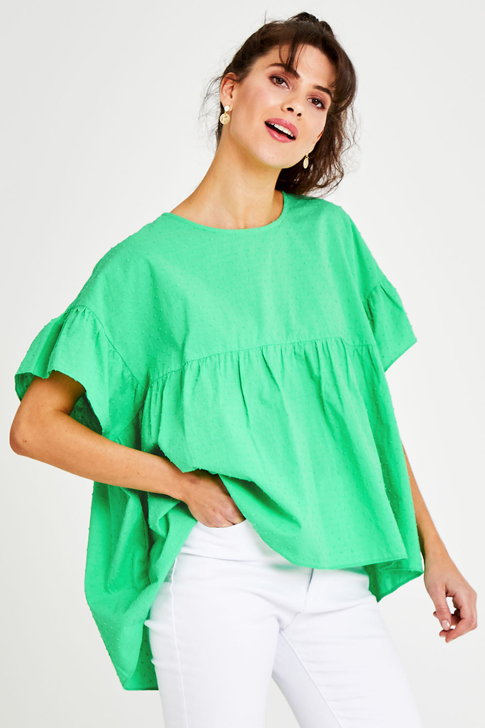 Model Courtney wearing size 10 of the Dana Top in colour Celery (Green), from the front, cropped image