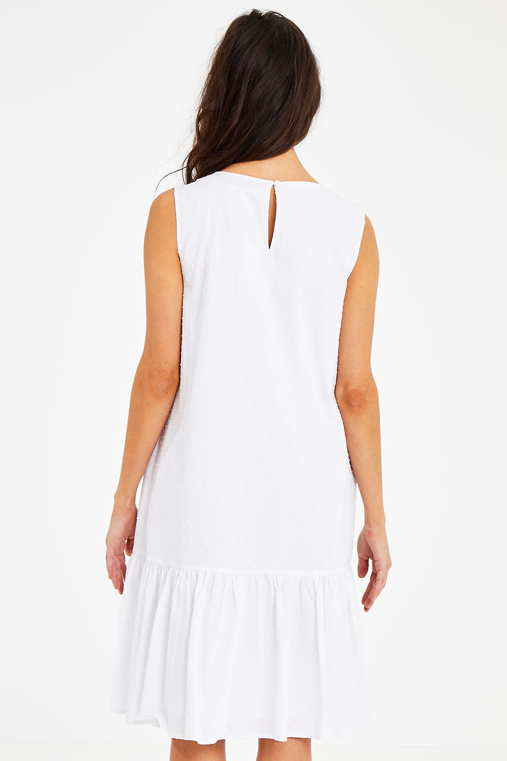 Model Courtney wearing size 10 of the Shiloh Dress in colour White (White), from the back