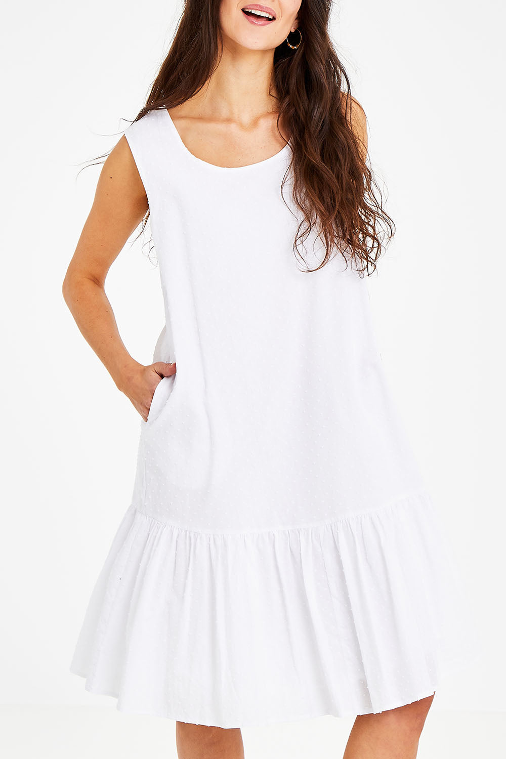 Model Courtney wearing size 10 of the Shiloh Dress in colour White (White), from the front, cropped image