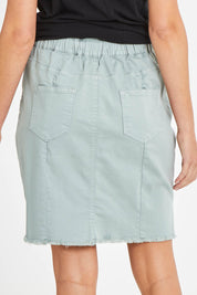 Model Madeline wearing size 10 of the Aston Skirt in colour Sage (Green), from the back