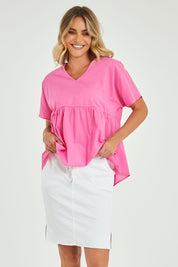 Model Alice wearing size 10 of the Aston Skirt in colour White (White), from the front, cropped image