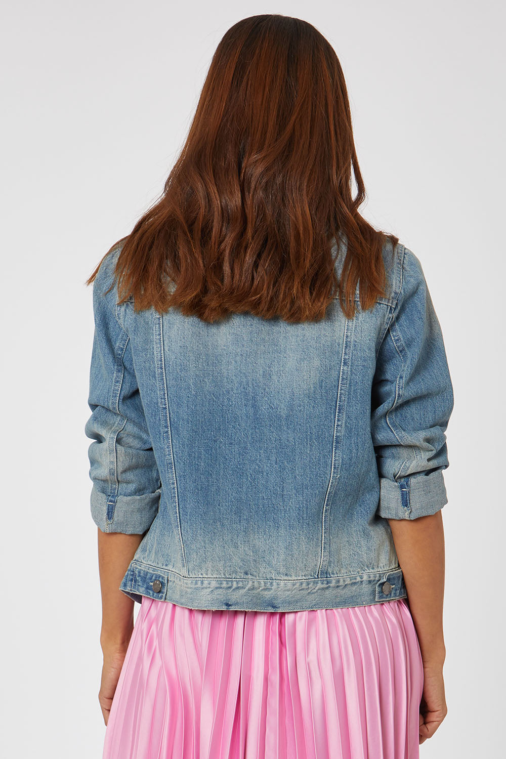 Model Cara wearing size 10 of the Hudson Denim Jacket in colour Vintage (Blue), from the back