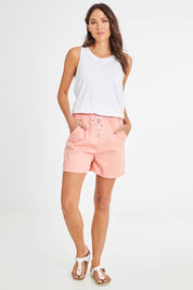 Model Madeline wearing size 10 of the Debbie Denim Jogger Shorts in colour Peachpink (Pink), from the front, showing the whole outfit