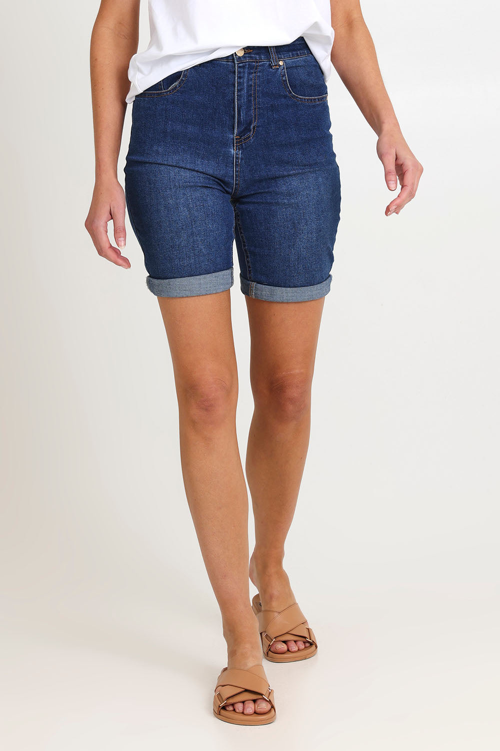 Model Madeline wearing size 10 of the Bonnie Bermuda Denim Short in colour Blue (Blue), from the front, cropped image