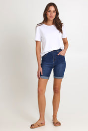 Model Madeline wearing size 10 of the Bonnie Bermuda Denim Short in colour Blue (Blue), from the front, showing the whole outfit