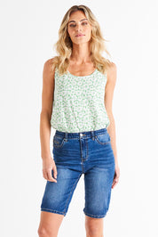 A model wearing the Bonnie Bermuda Denim Short in colour Indigo (Blue), from the front, cropped image