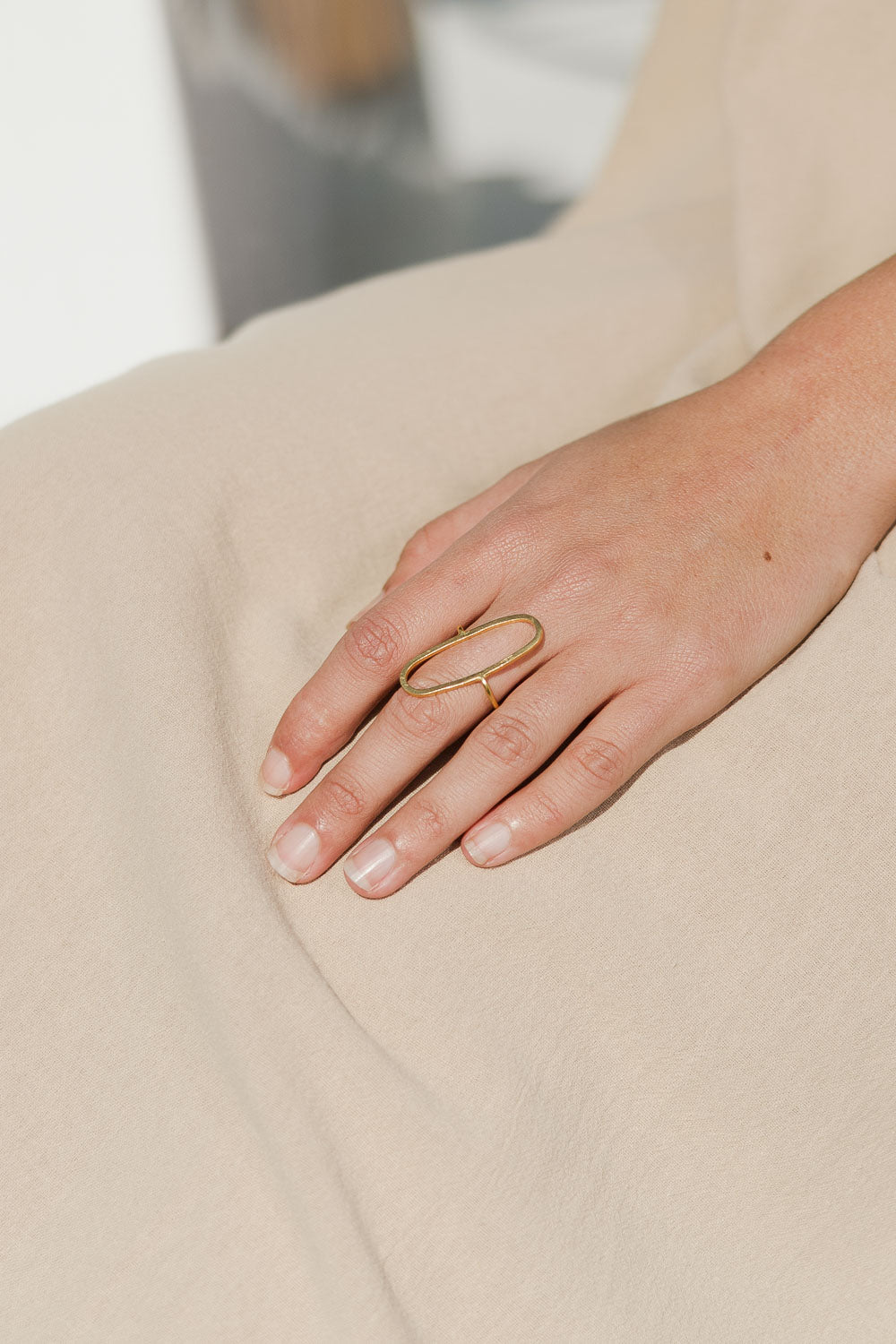 A model wearing size OneSize of the Adjustable Brass Oval Ring in colour Goldbrass (Metallics), from the front, showing the whole outfit