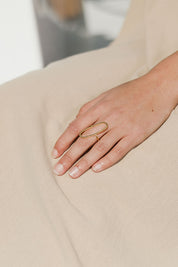 A model wearing size OneSize of the Adjustable Brass Oval Ring in colour Goldbrass (Metallics), from the front, showing the whole outfit