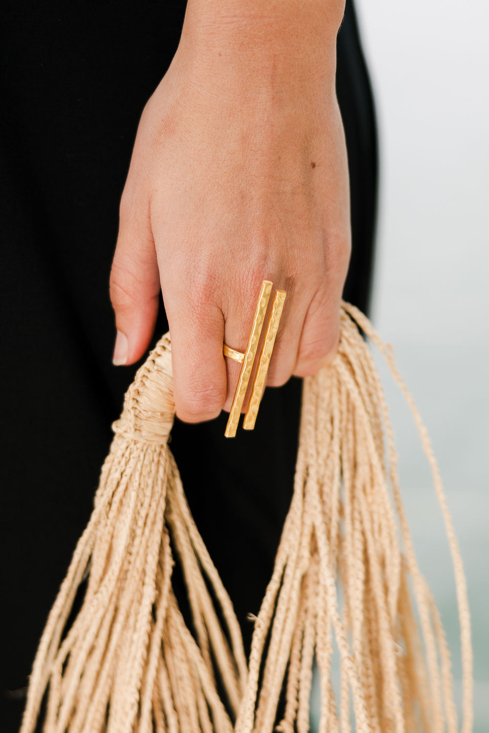 A model wearing size OneSize of the Adjustable Hammered Brass Double Bar Ring in colour Goldbrass (Metallics), from the front, showing the whole outfit