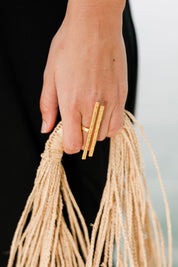 A model wearing size OneSize of the Adjustable Hammered Brass Double Bar Ring in colour Goldbrass (Metallics), from the front, showing the whole outfit