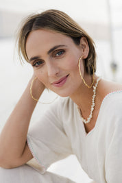 Model Tegan wearing size OneSize of the Hammered Brass Open Hoops in colour Goldbrass (Metallics), from the front, showing the whole outfit