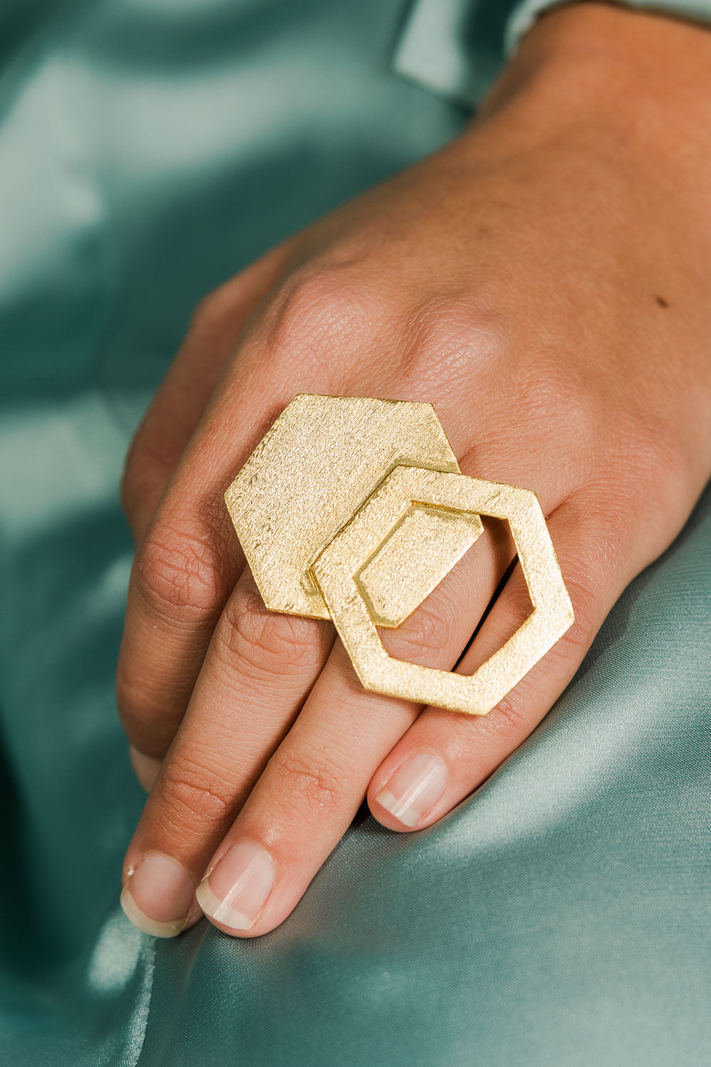 A model wearing size OneSize of the Brass Hexagon Ring in colour Goldbrass (Metallics), from the front, showing the whole outfit