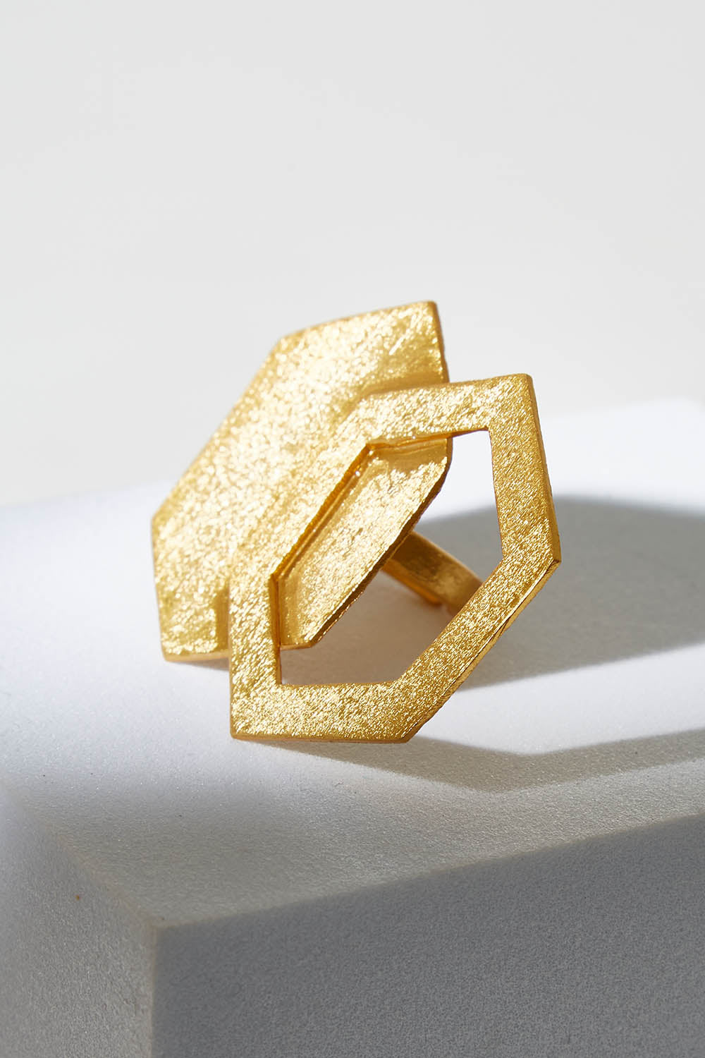 A model wearing size OneSize of the Brass Hexagon Ring in colour Goldbrass (Metallics), from the front, showing the whole outfit