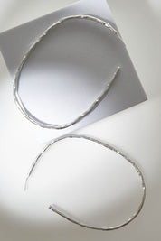 A model wearing size OneSize of the Brass Hammered Oversize Open Hoop Earrings in colour Silvbrass (Metallics), from the front, showing the whole outfit