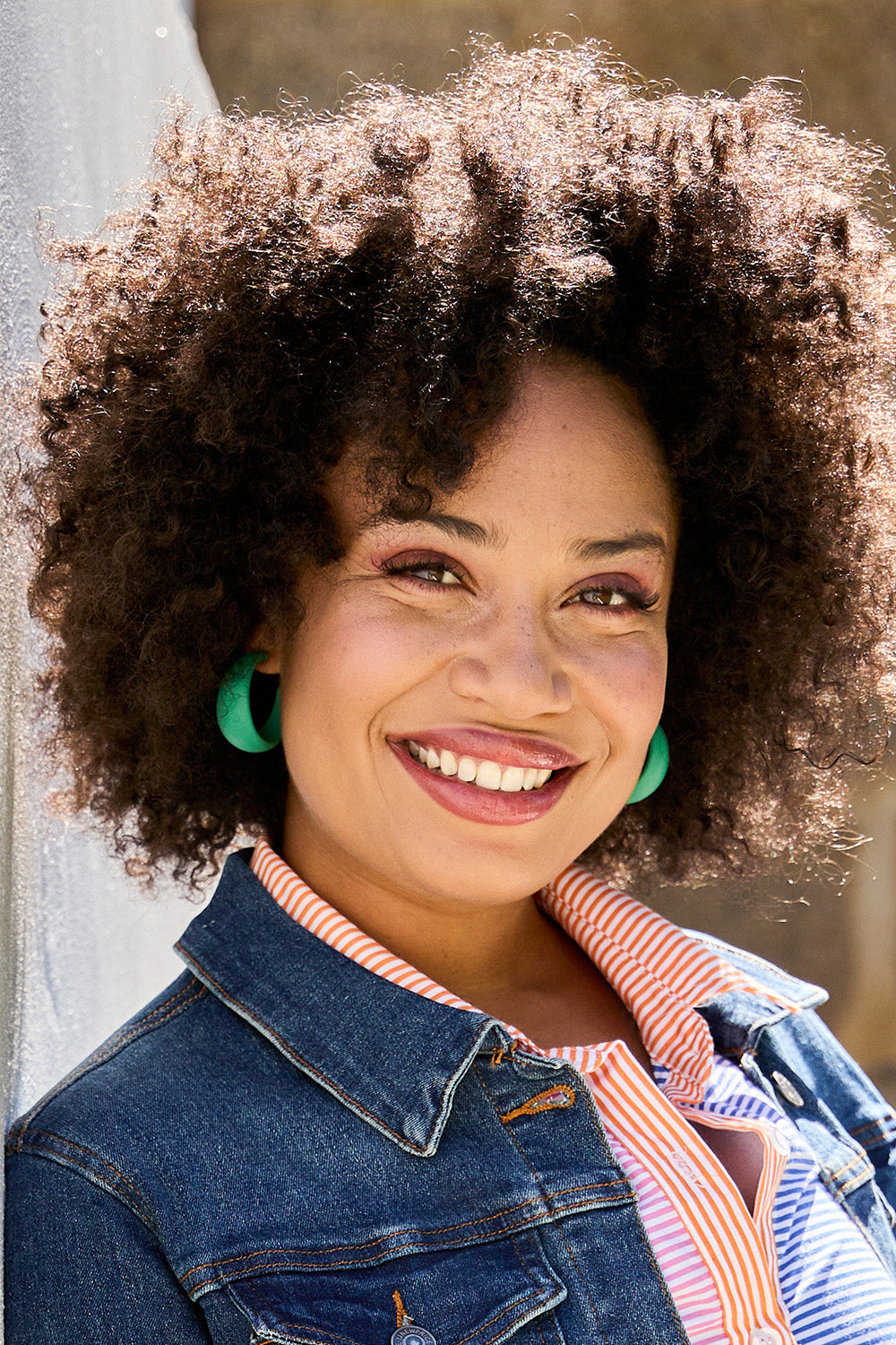 Model Olivia wearing size OneSize of the Coloured Hoop Earrings in colour Green (Green), from the front, showing the whole outfit