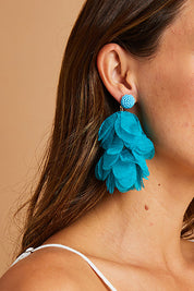 A model wearing size OneSize of the Bunch of Colour Earrings in colour Teal (Blue), from the front, showing the whole outfit