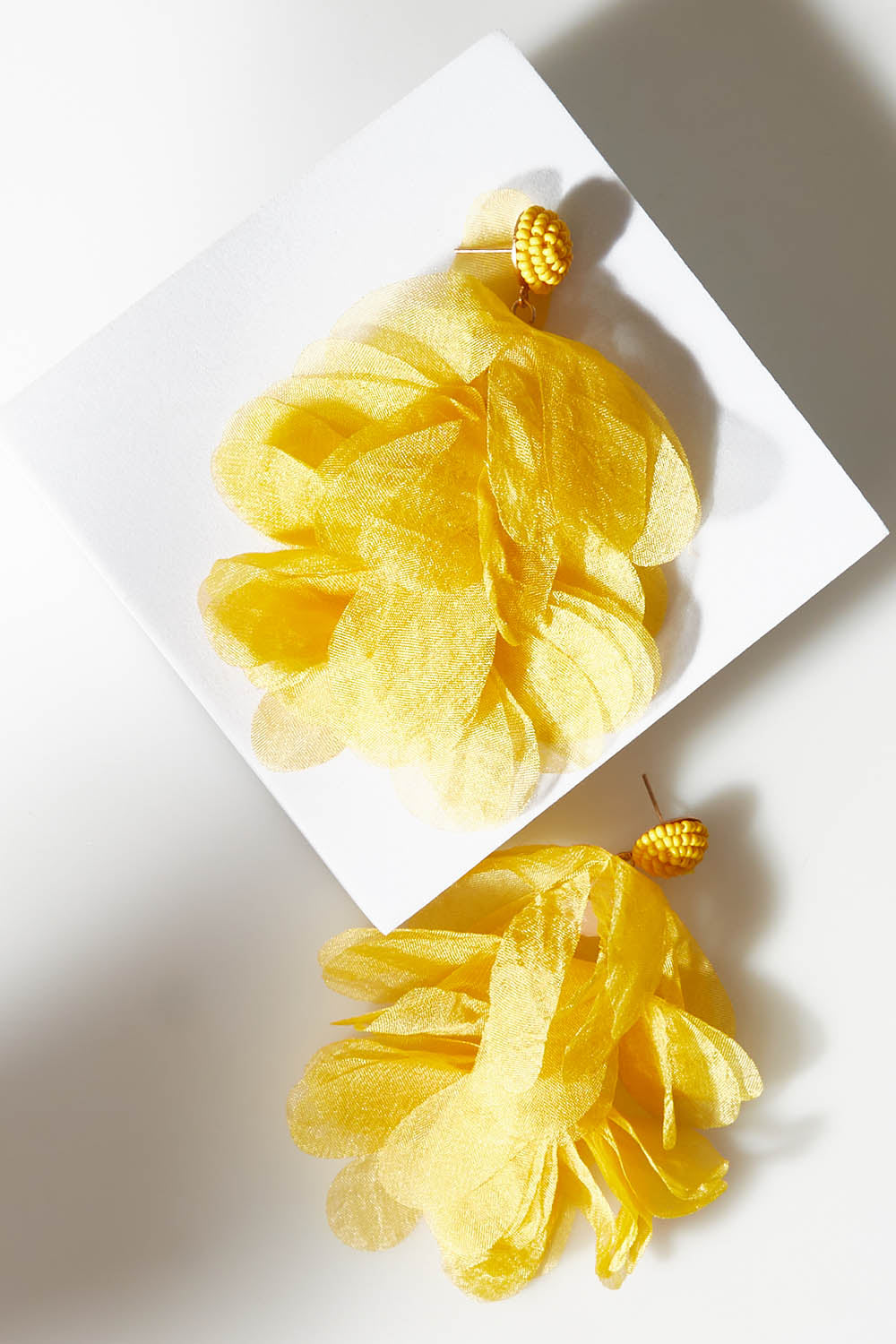 A model wearing size OneSize of the Bunch of Colour Earrings in colour Yellow, from the front, showing the whole outfit