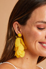 A model wearing size OneSize of the Bunch of Colour Earrings in colour Yellow, from the front, showing the whole outfit