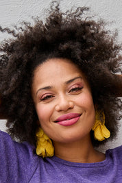 Model Olivia wearing size OneSize of the Bunch of Colour Earrings in colour Yellow, from the front, showing the whole outfit