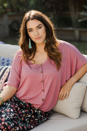 Model Laura wearing size 14 of The Relaxed Button Bamboo Tee in colour Dustypink (Pink), from the front, showing the whole outfit