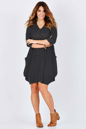 Model Laura wearing size 14 of The Spot Pocket Tunic Dress in colour Spot (Black), from the front, showing the whole outfit