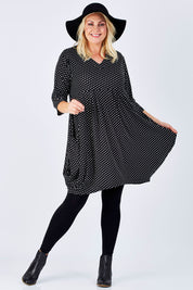 Model Natalie wearing size 16 of The Spot Pocket Tunic Dress in colour Spot (Black), from the front, showing the whole outfit