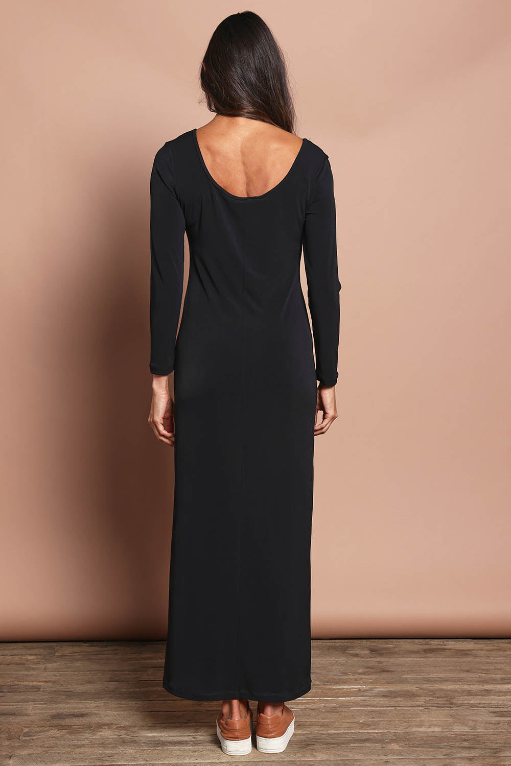 Model Amanda wearing size 10 of The Long Sleeve Comfort Maxi in colour Black (Black), from the back