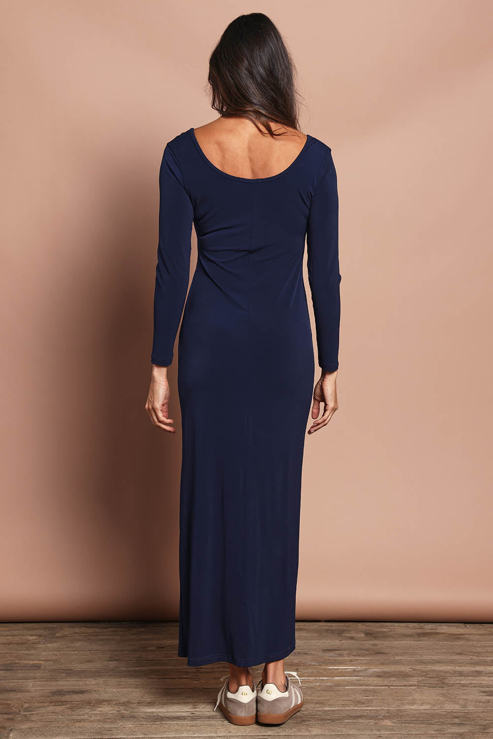 Model Amanda wearing size 10 of The Long Sleeve Comfort Maxi in colour Navy (Blue), from the back