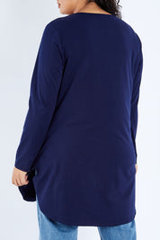 Model Sasha-Lee wearing size 16 of The Cotton Long Sleeve Boyfriend Tee in colour Navy (Blue), from the back