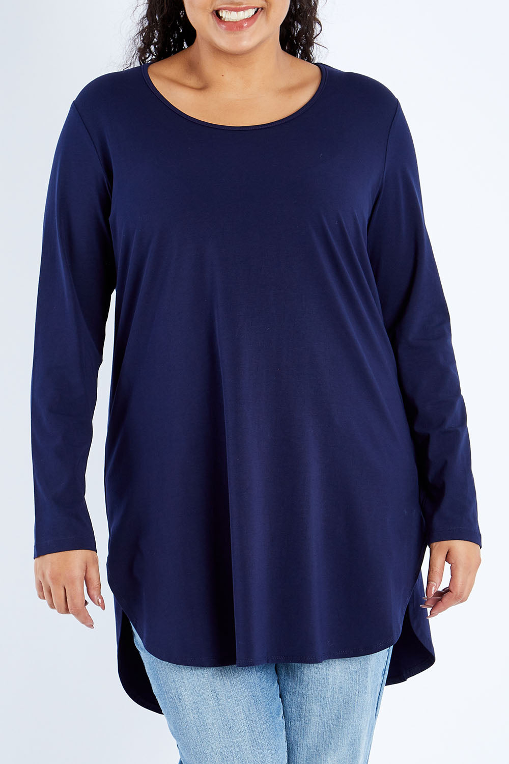 Model Sasha-Lee wearing size 16 of The Cotton Long Sleeve Boyfriend Tee in colour Navy (Blue), from the front, cropped image