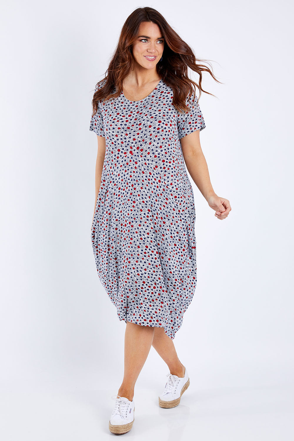 Model Laura wearing size 14 of The Short Sleeve Bounce Dress in colour Spot (White), from the front, showing the whole outfit