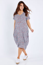 Model Laura wearing size 14 of The Short Sleeve Bounce Dress in colour Spot (White), from the front, showing the whole outfit