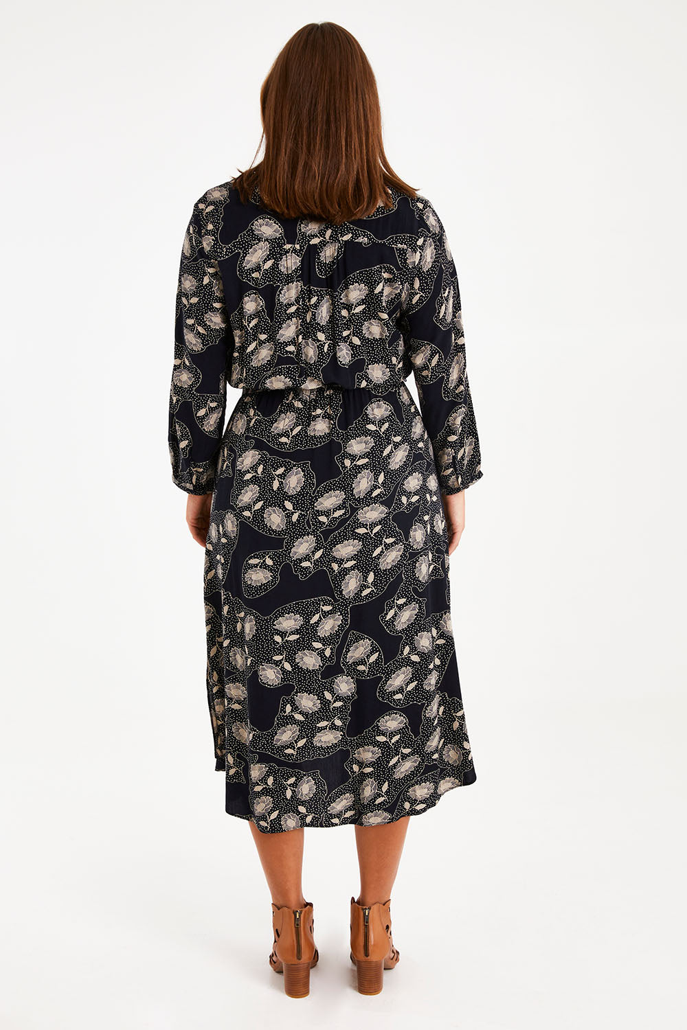 Model Monique wearing size 14 of The Wrap Front Midi Dress in colour Navytaupe (Blue), from the back