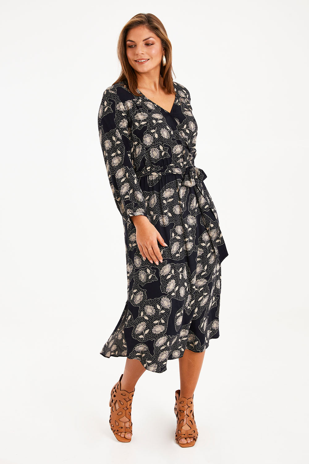 Model Monique wearing size 14 of The Wrap Front Midi Dress in colour Navytaupe (Blue), from the front, showing the whole outfit