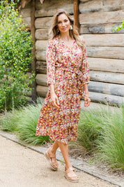 Model Amanda wearing size 10 of The Wrap Front Midi Dress in colour Redfloral (Red), from the front, showing the whole outfit