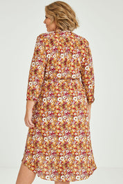 Model Fiona wearing size 16 of The Wrap Front Midi Dress in colour Redfloral (Red), from the back