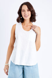 Model Andrea wearing size 10 of The Long Line Tank in colour White (White), from the front, cropped image