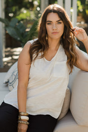 Model Laura wearing size 14 of The Long Line Tank in colour White (White), from the front, showing the whole outfit