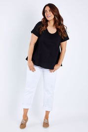 Model Laura wearing size 14 of The Short Sleeve Swing Tee in colour Black (Black), from the front, showing the whole outfit