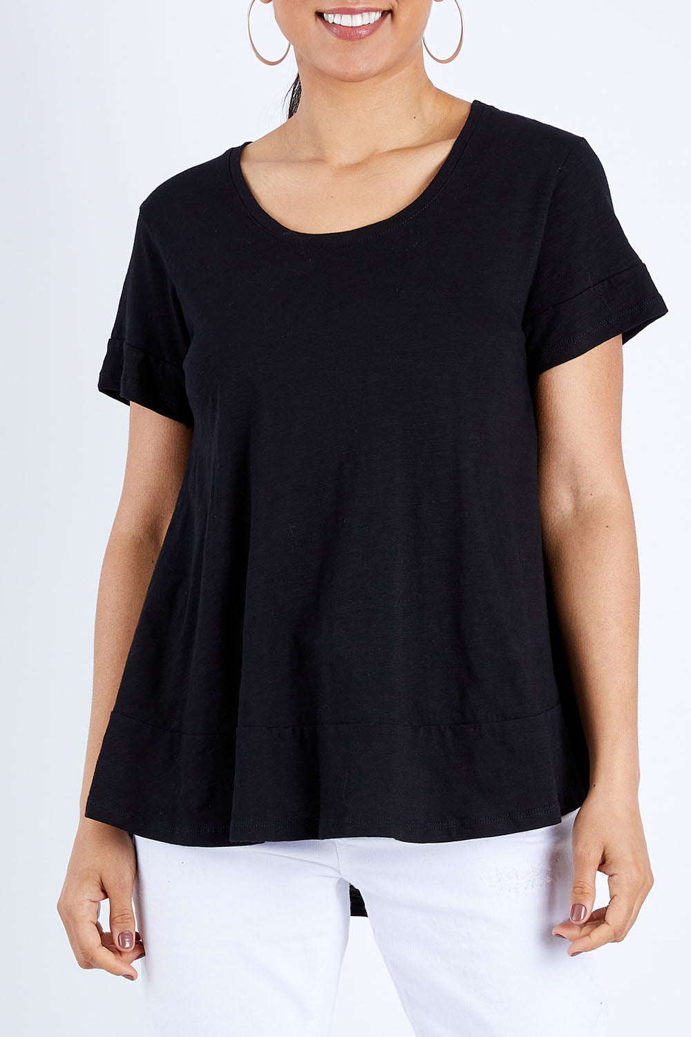 Model Pamela wearing size 10 of The Short Sleeve Swing Tee in colour Black (Black), from the front, cropped image