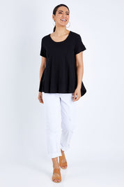 Model Pamela wearing size 10 of The Short Sleeve Swing Tee in colour Black (Black), from the front, showing the whole outfit