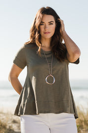 Model Laura wearing size 14 of The Short Sleeve Swing Tee in colour Khaki (Green), from the front, showing the whole outfit