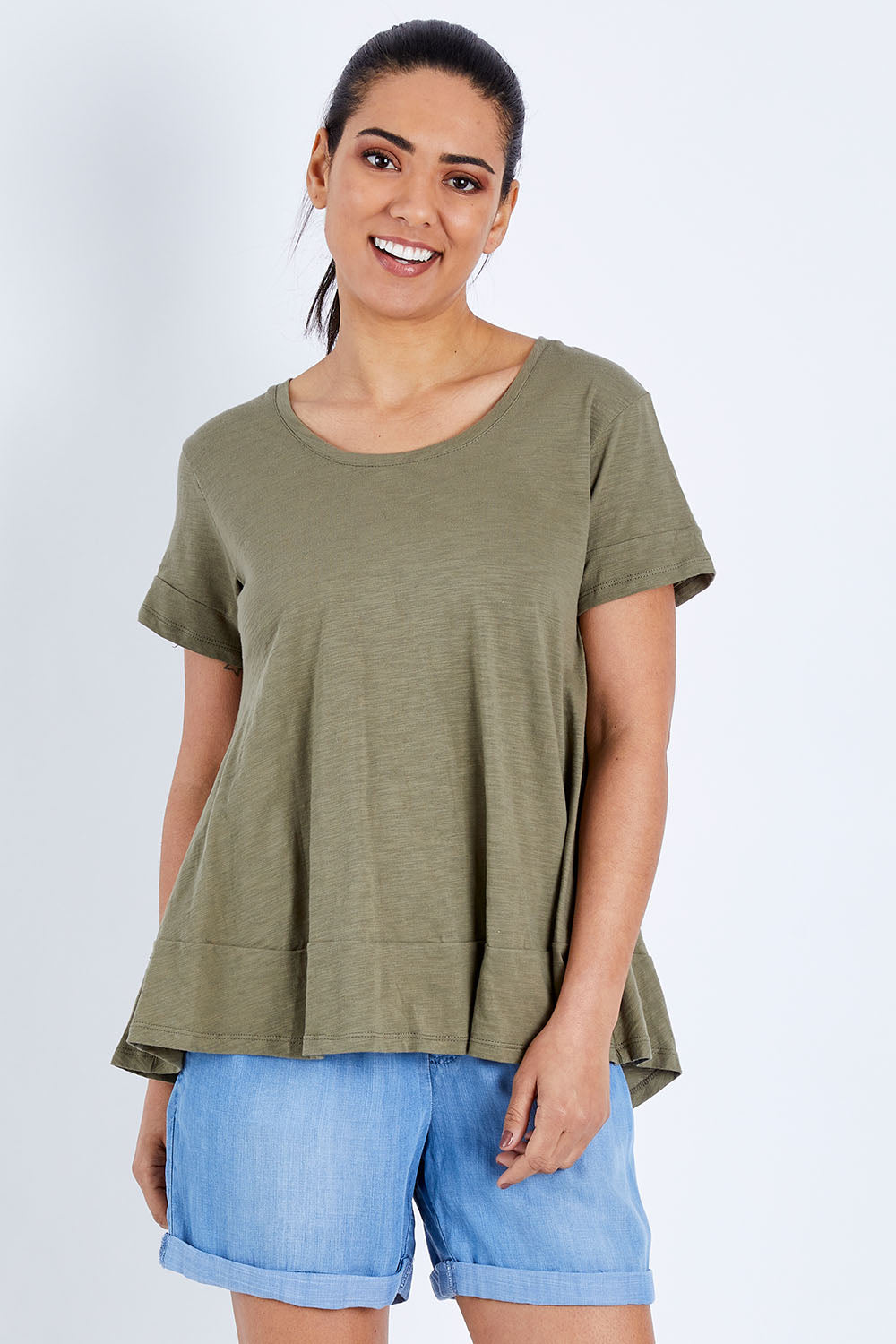 Model Pamela wearing size 10 of The Short Sleeve Swing Tee in colour Khaki (Green), from the front, cropped image