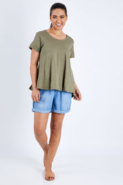 Model Pamela wearing size 10 of The Short Sleeve Swing Tee in colour Khaki (Green), from the front, showing the whole outfit
