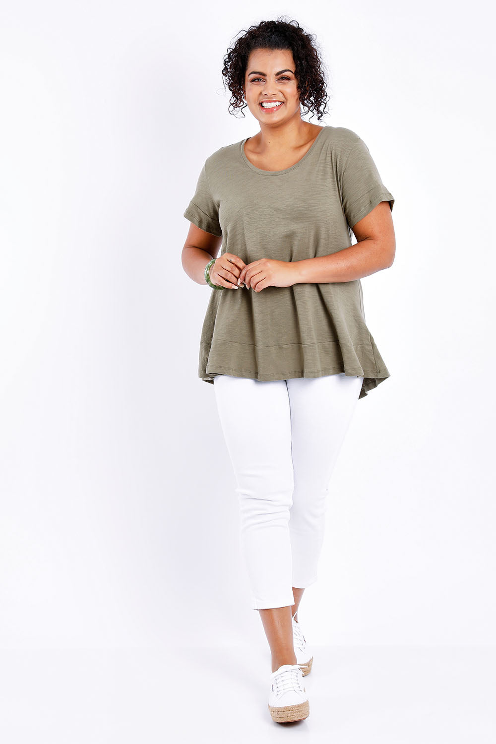 Model Sasha-Lee wearing size 16 of The Short Sleeve Swing Tee in colour Khaki (Green), from the front, showing the whole outfit