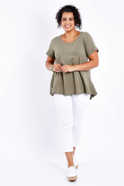 Model Sasha-Lee wearing size 16 of The Short Sleeve Swing Tee in colour Khaki (Green), from the front, showing the whole outfit