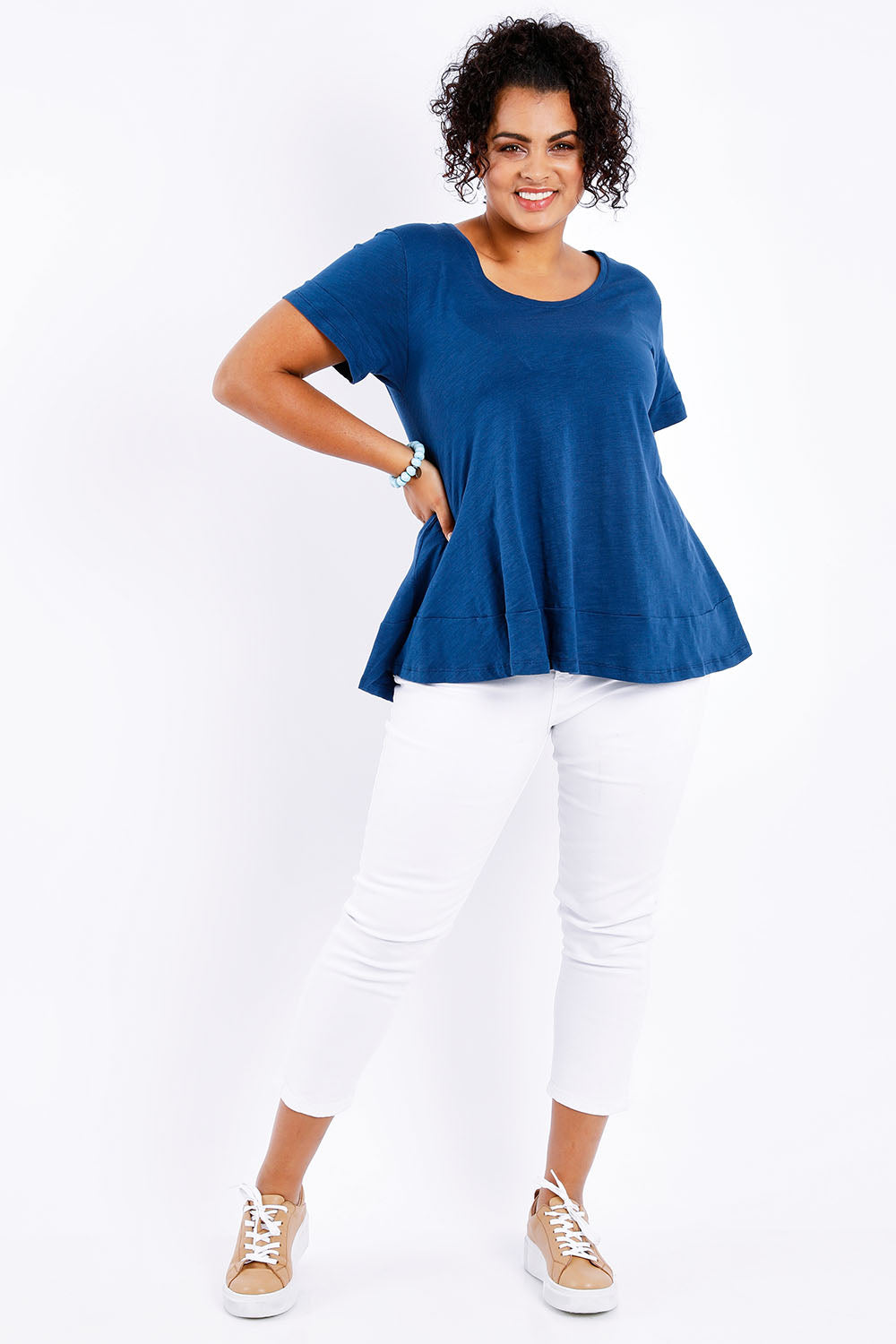 Model Sasha-Lee wearing size 16 of The Short Sleeve Swing Tee in colour Navy (Blue), from the front, showing the whole outfit
