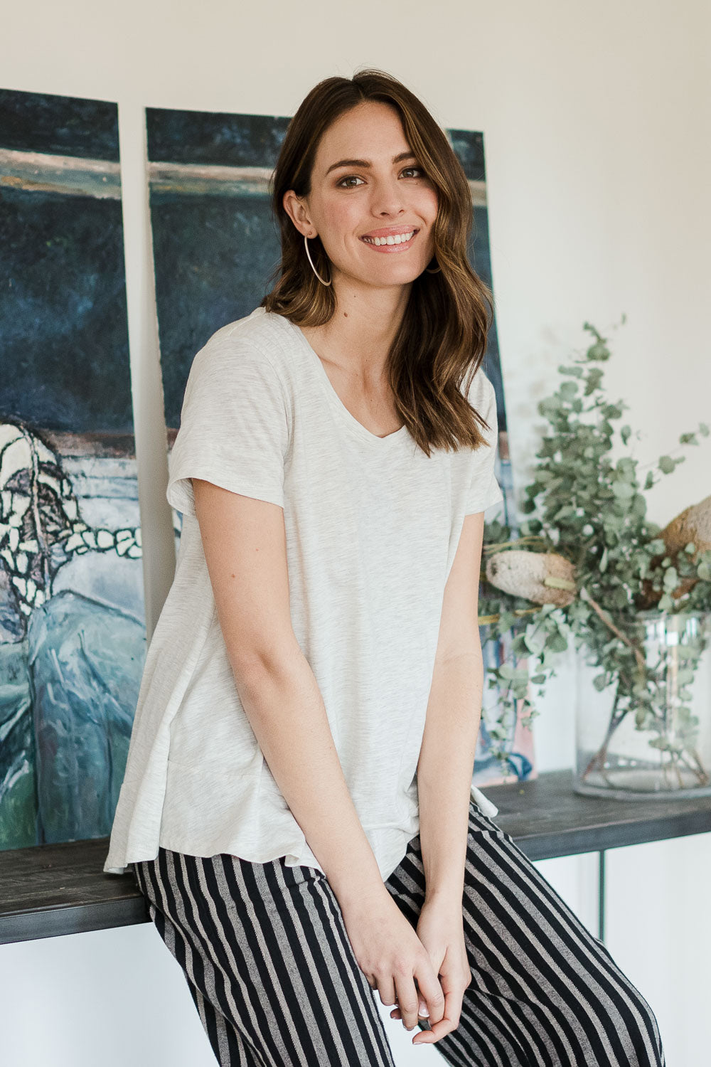 Model Madeline wearing size 10 of The Short Sleeve Swing Tee in colour Oatmeal, from the front, showing the whole outfit