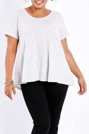 Model Sasha-Lee wearing size 16 of The Short Sleeve Swing Tee in colour Oatmeal, from the front, cropped image